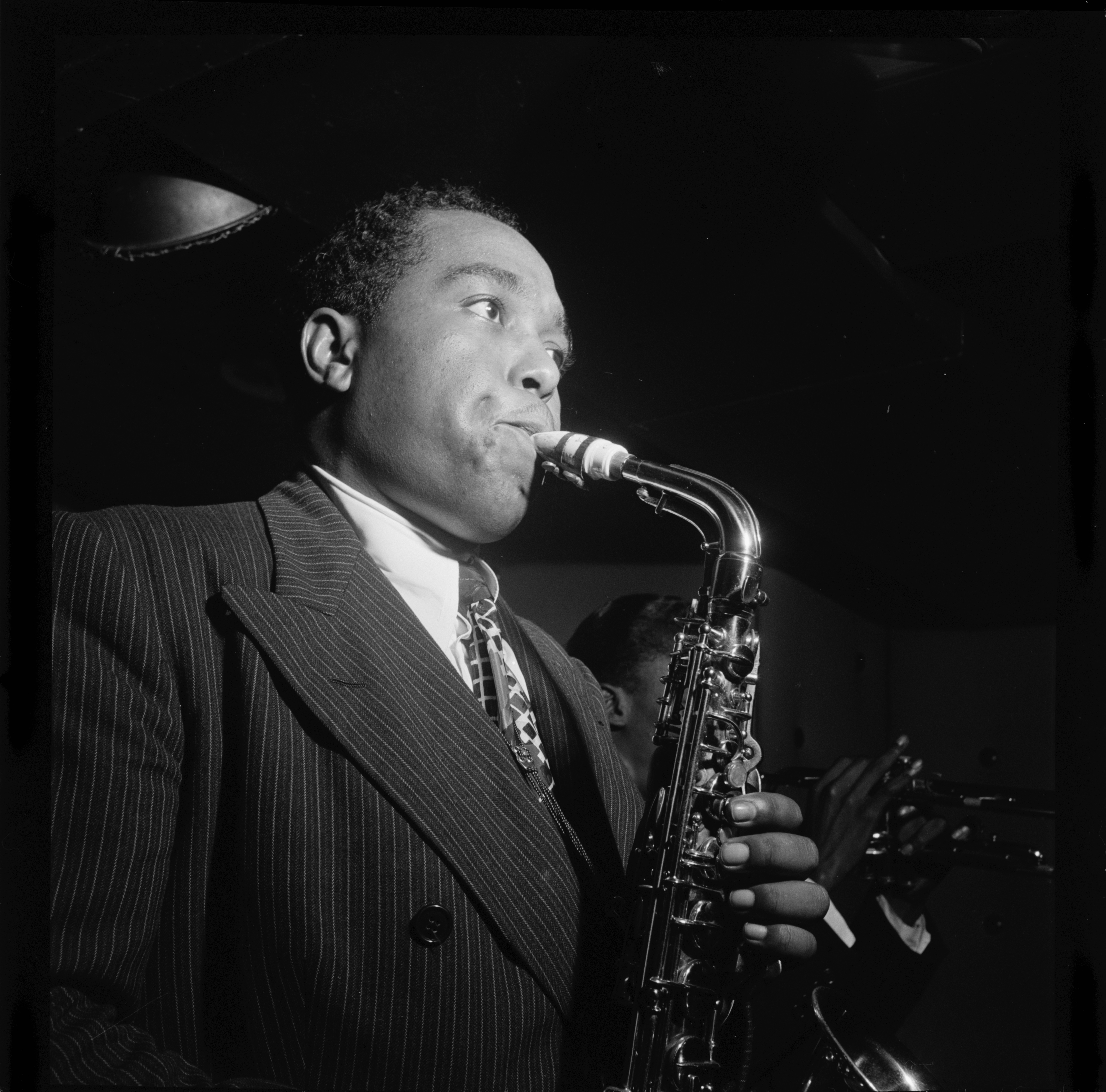 Picture of Charlie Parker playing saxophone.