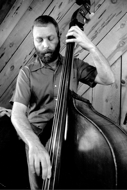 Picture of Dave Holland playing bass.