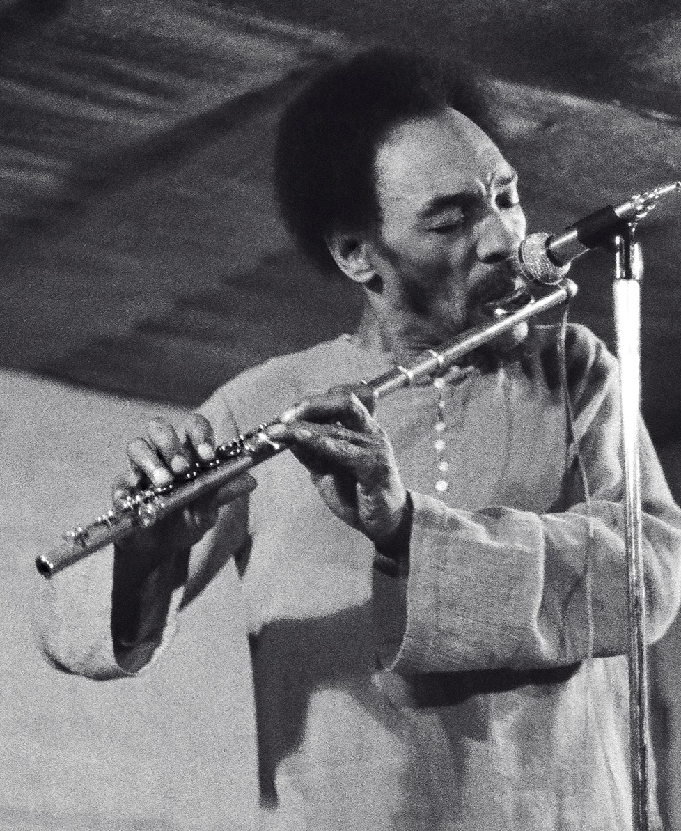 Picture of Sam Rivers playing flute.